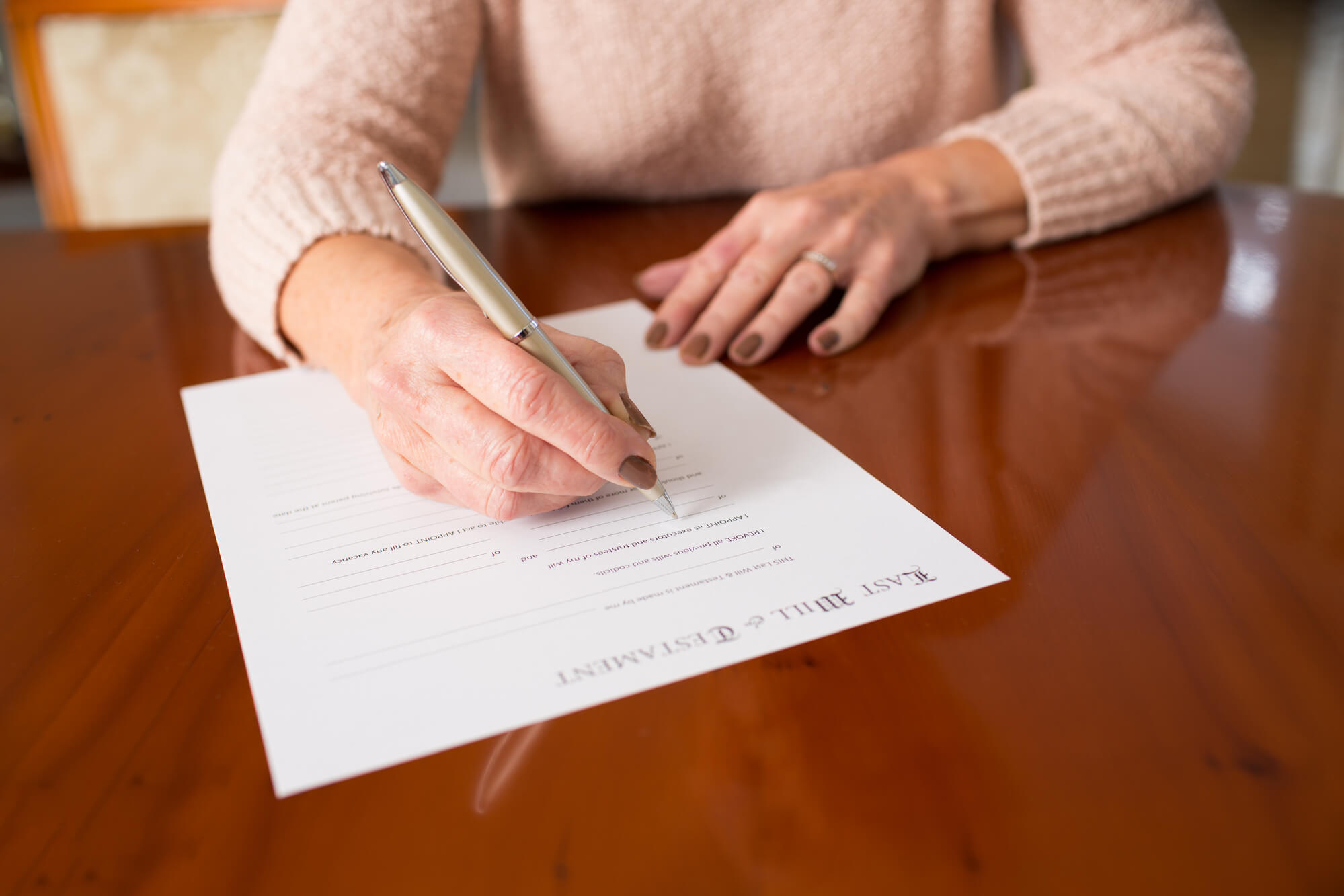 How Can I Avoid Paying Estate/Inheritance Taxes When I'm Gone? - person signing will
